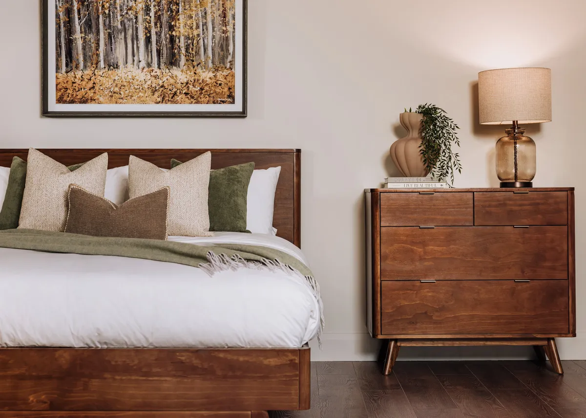 A lifetsyle image of the Velmora chest with Emily lamp and woodland warmth picture.
