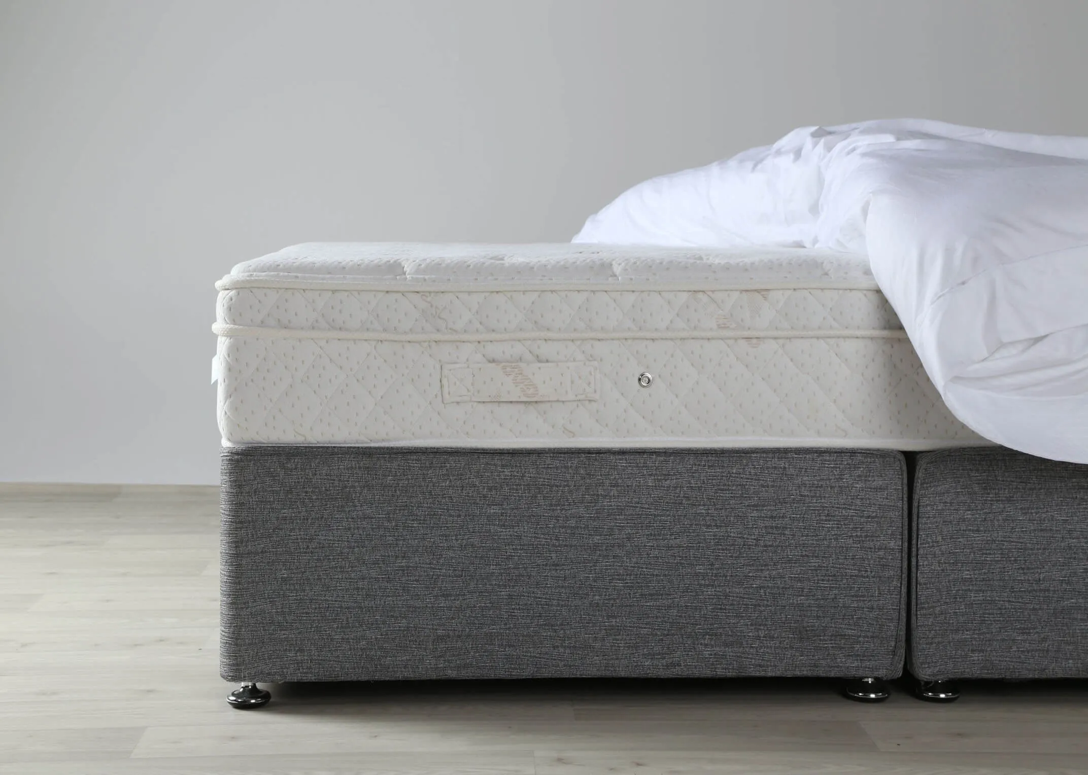 A close up of the side of the Majesty Cashmere 3 foot mattress on a bed frame.
