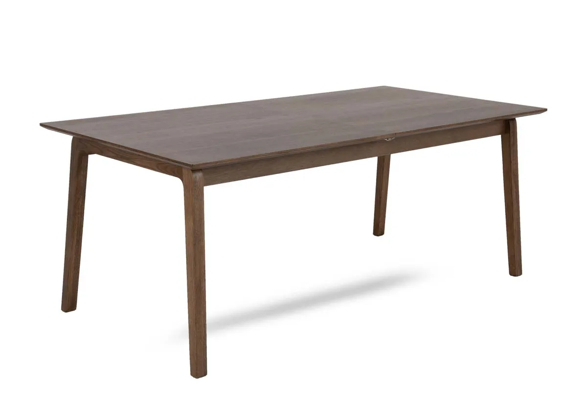 A smoked oak dining table from EZ Livings Bari range. Angled view of fixed table.