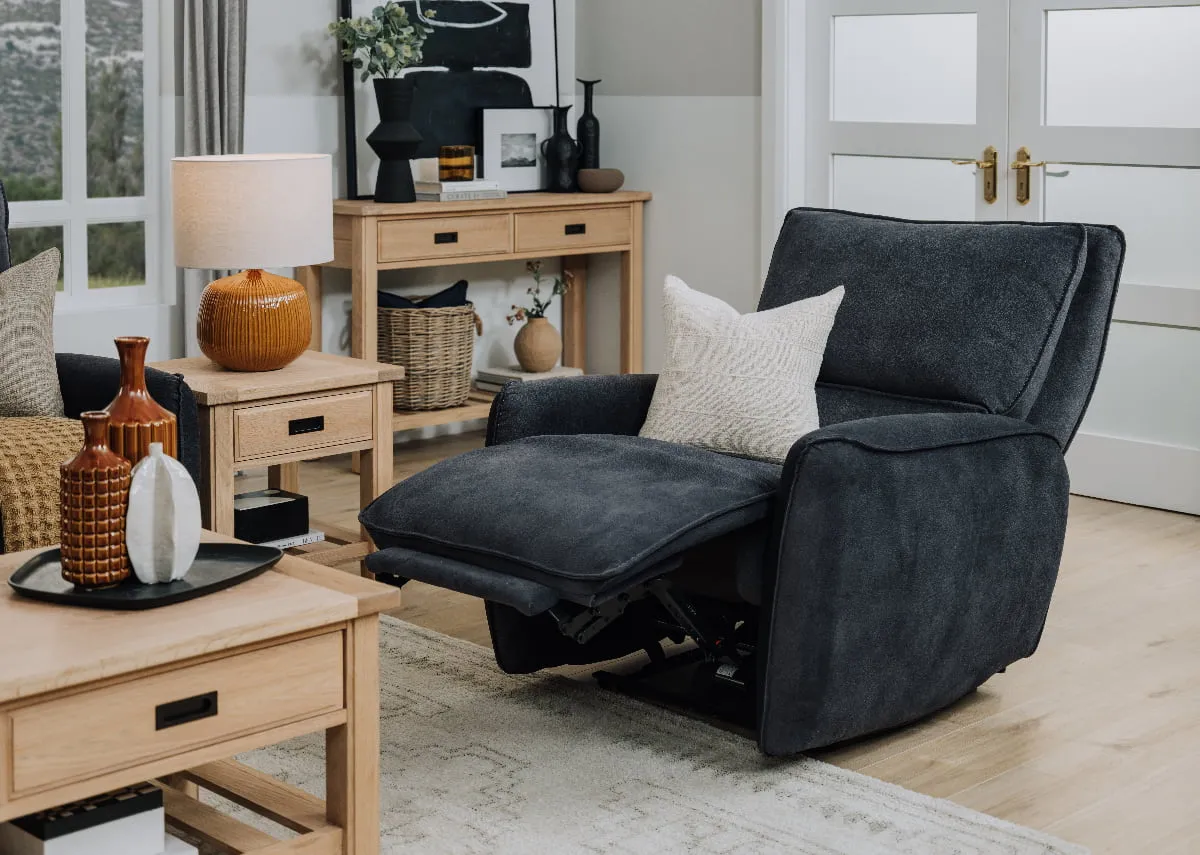 A lifestyle image of the Quentin recliner with Albany coffee table