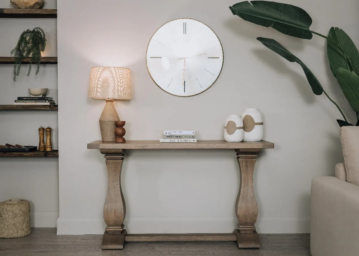 A lifestyle image of the Gold Coast Console table with Mai lamp and Danai vases
