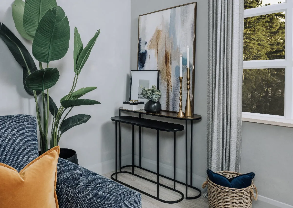 A lifestyle image of the Budi Console table with Inspre canvas with Lincoln sofa range.