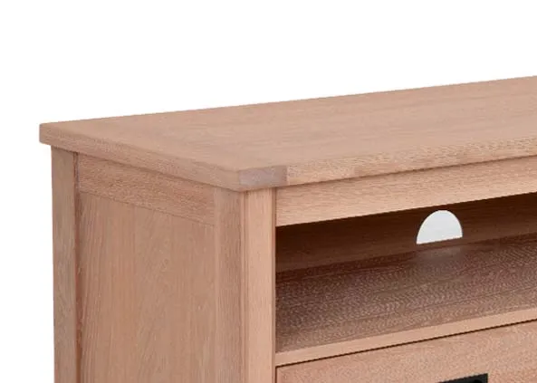 A 2 drawer oak TV unit from EZ Livings Albany range. Closeup of shelving.