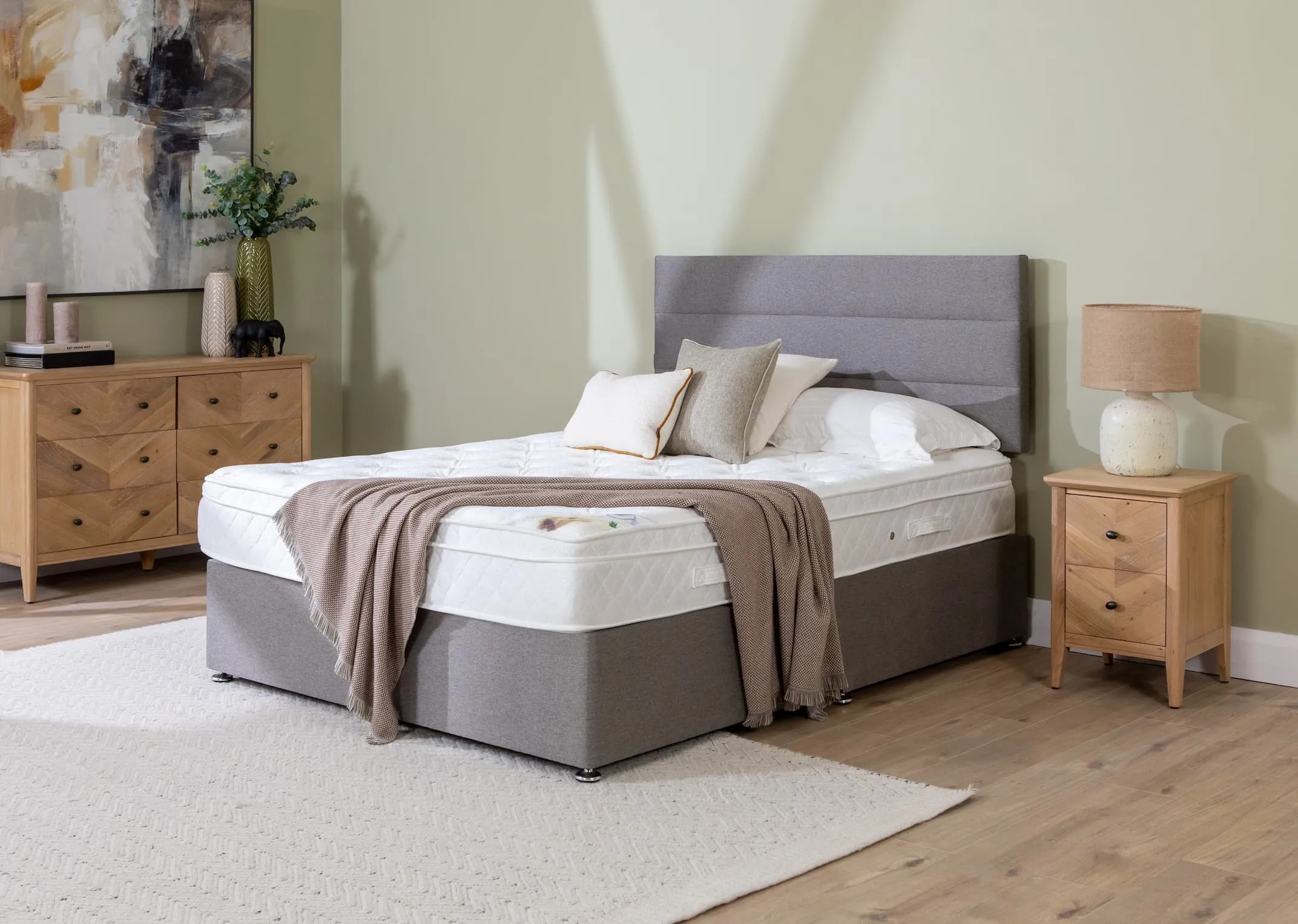 A lifestyle image of the Emilys dream mattress on a Modena bed base and headboard with the Chevron locker & chest.