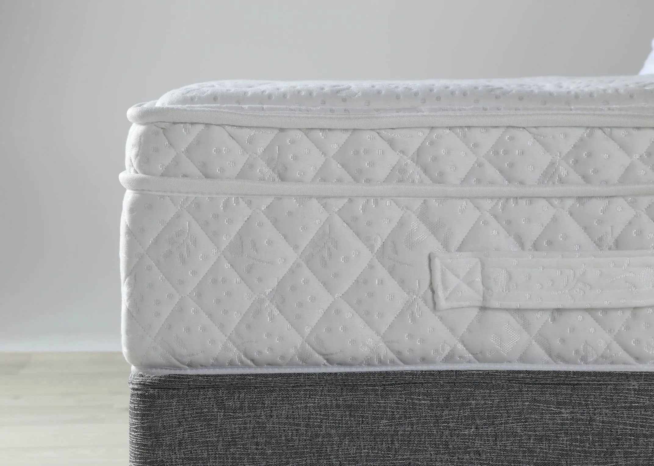 A close up of the Emilys Dream 5 foot king size mattress on a bed frame.