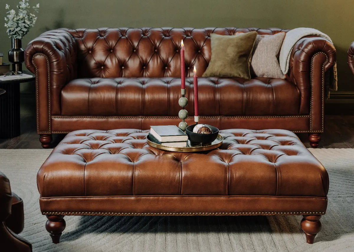 A lifestyle image of the Adare footstool with 3 seater sofa