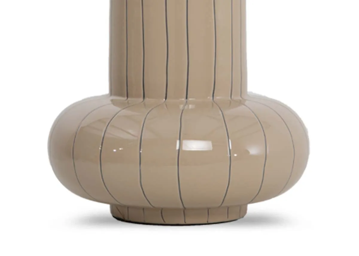 A glossy beige vase with ring base from EZ Livings Asano range. Closeup if round base