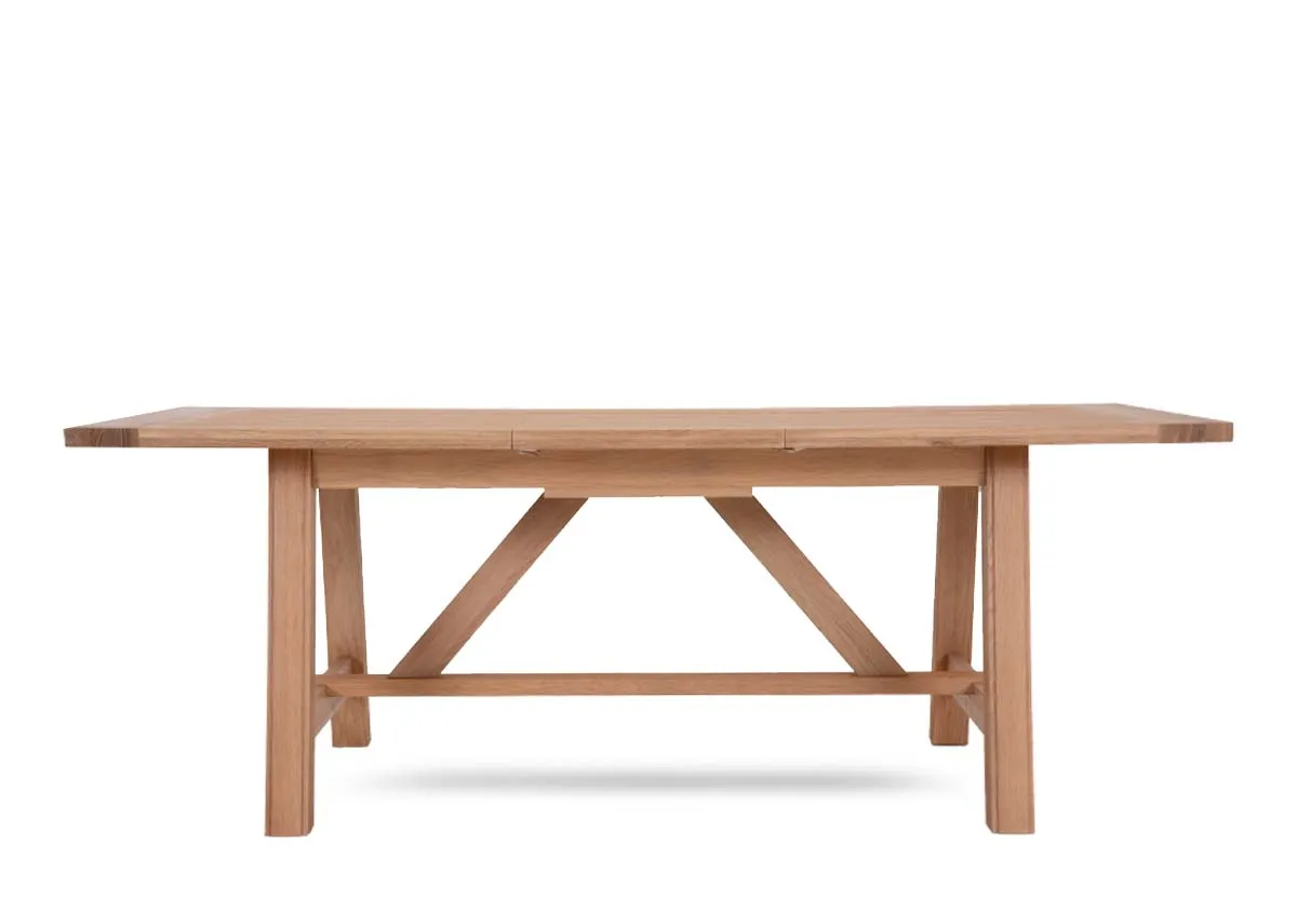 An oak dining table from EZ Livings Albany range. Front view of table shows thick textured top