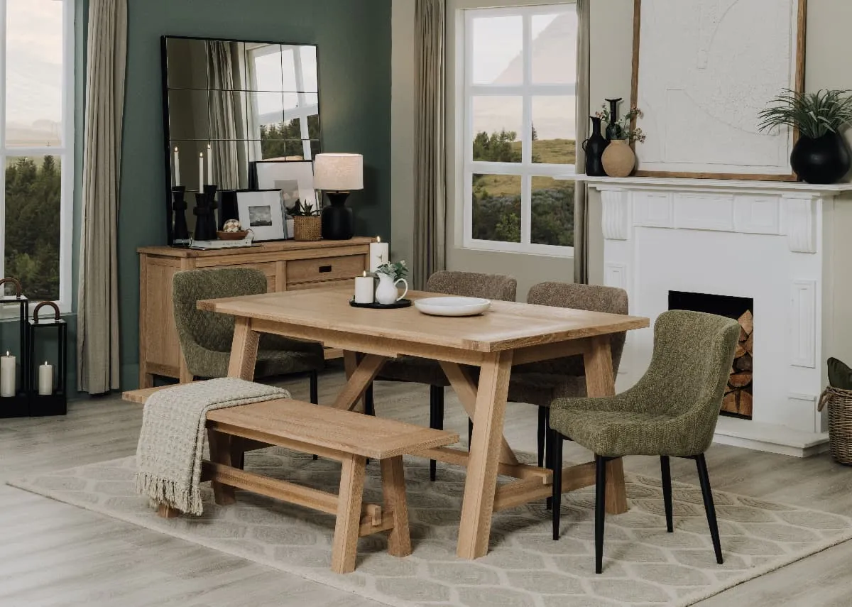 A lifestyle image of the Albany dining table & bench with Dylan chairs in green