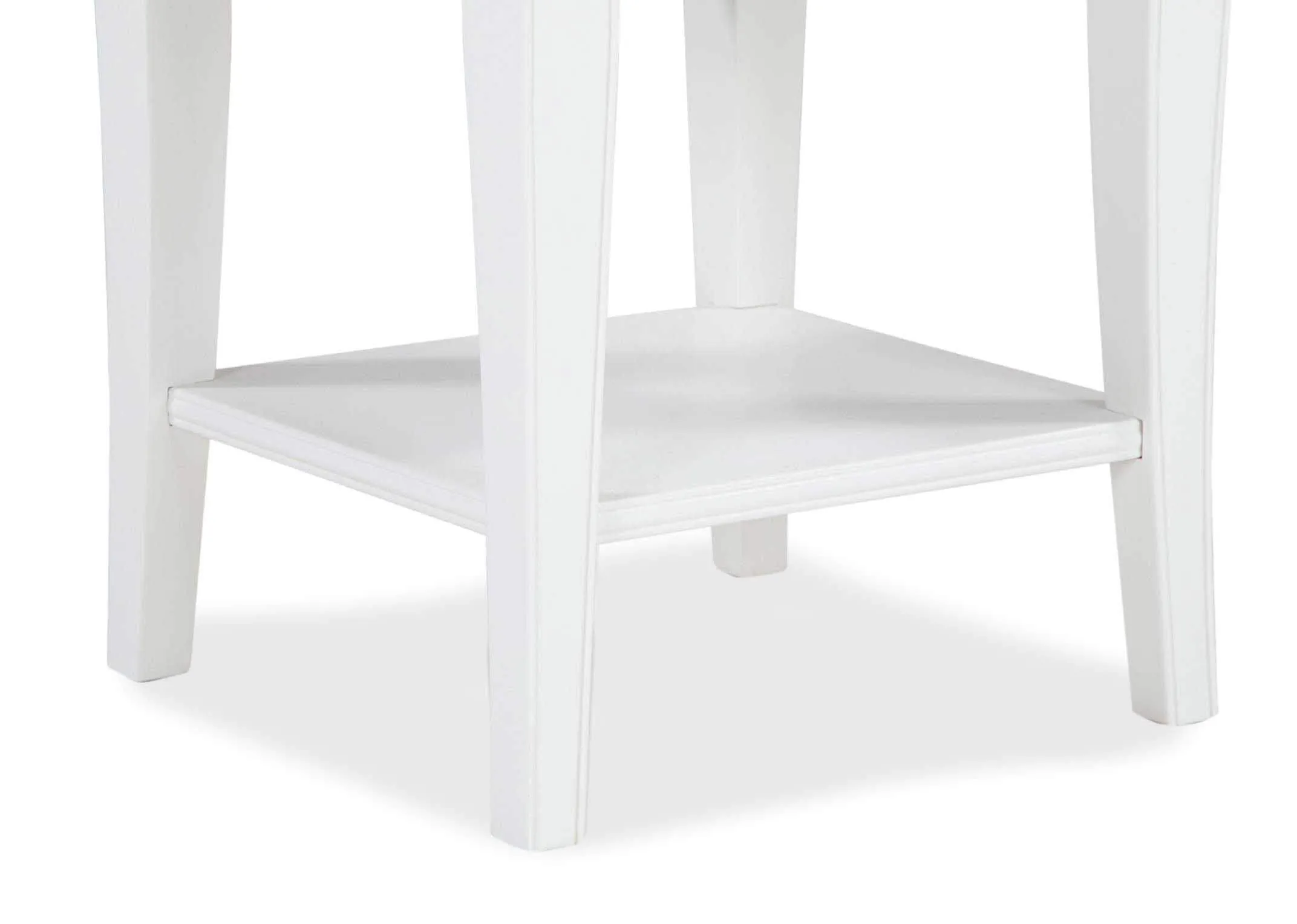 View of one-drawer white bedside locker with bottom shelf Chantilly in lifestyle setting paired with Tunda lamp & candle