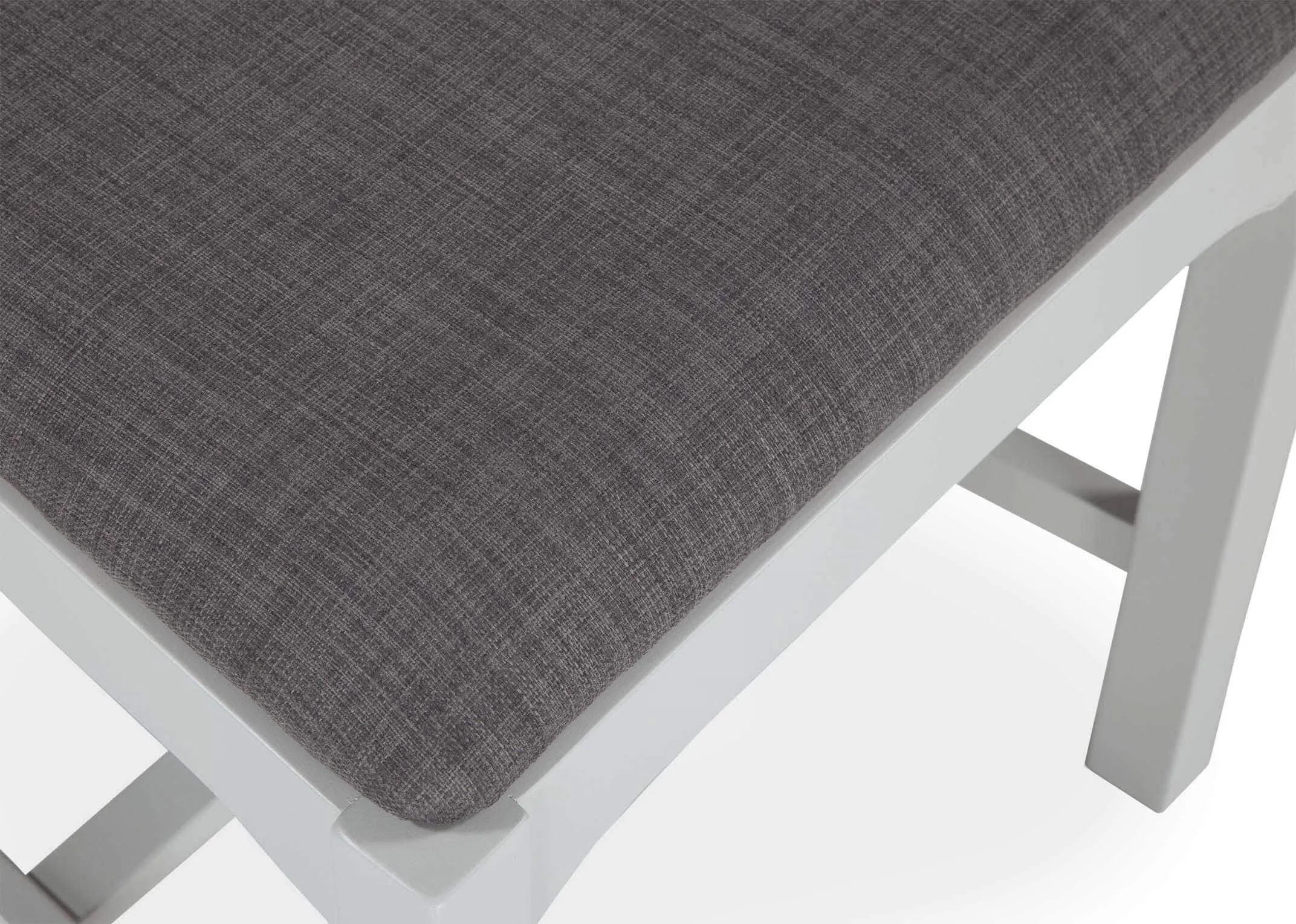 Close-up of dark grey seat fabric with grey oak support legs on view beneath as part of the Georgia grey oak dining chair
