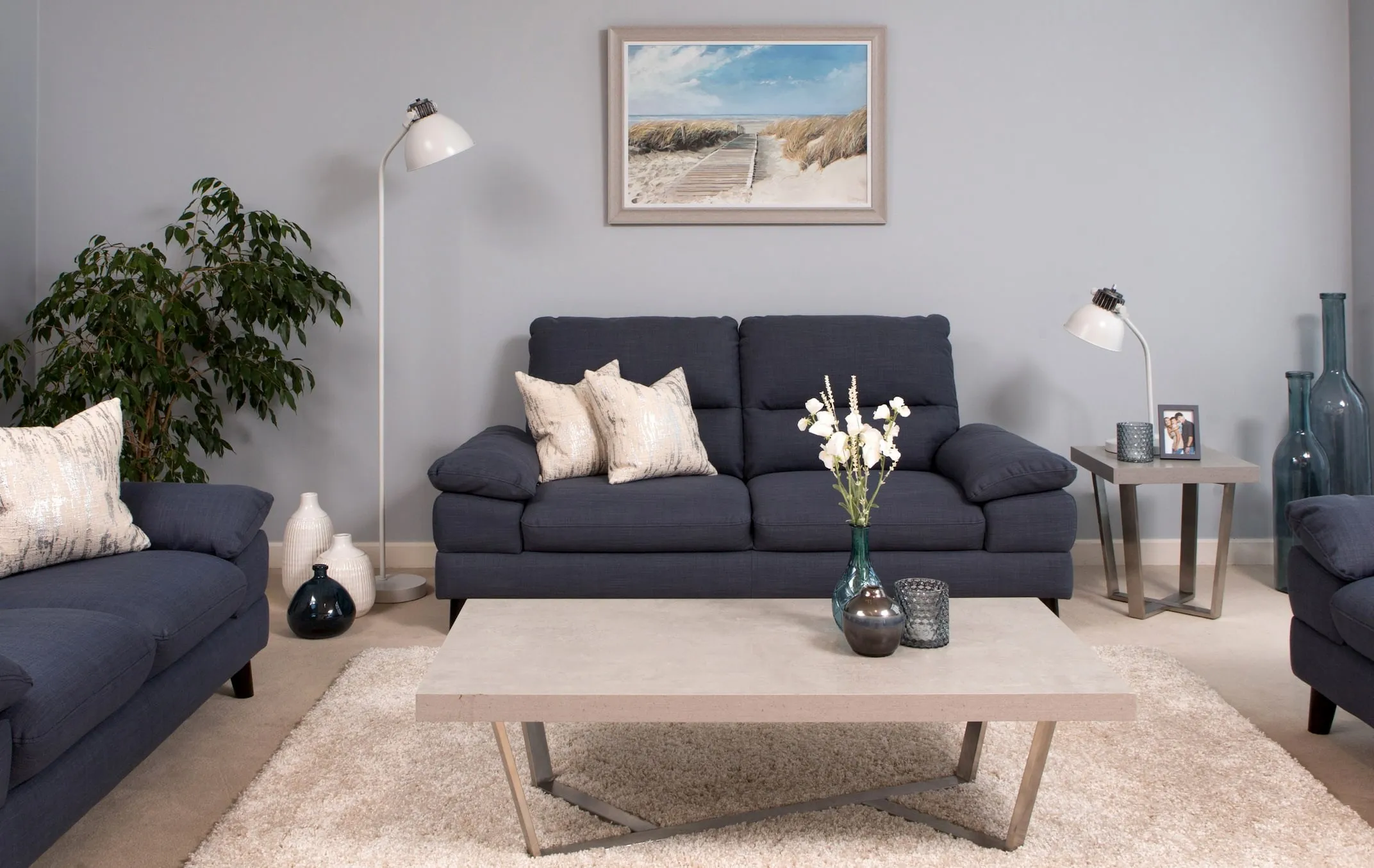 A living room including the View to Sea framed print by Adelene Fletcher from EZ Living Furniture's wall art range lifestyle.