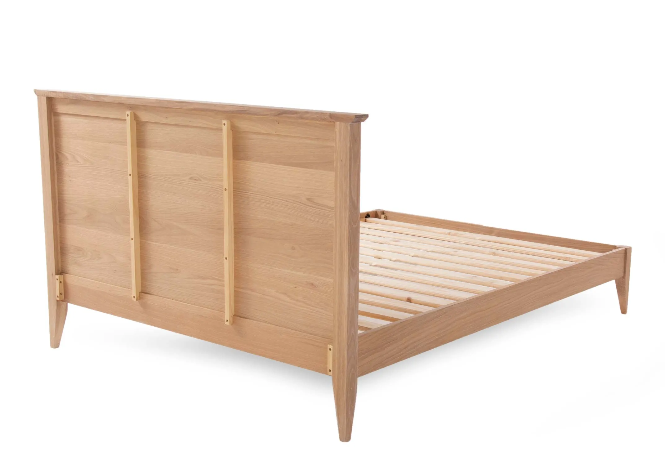 A double chevron wood bedframe with a mattress from EZ Living Furniture's Chevron range. Front view of bed with mattress