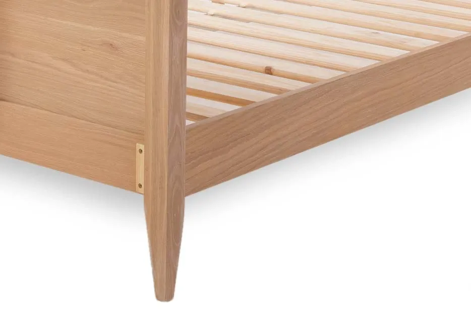 A double chevron wood bedframe with a mattress from EZ Living Furniture's Chevron range. Closeup of headboard pattern