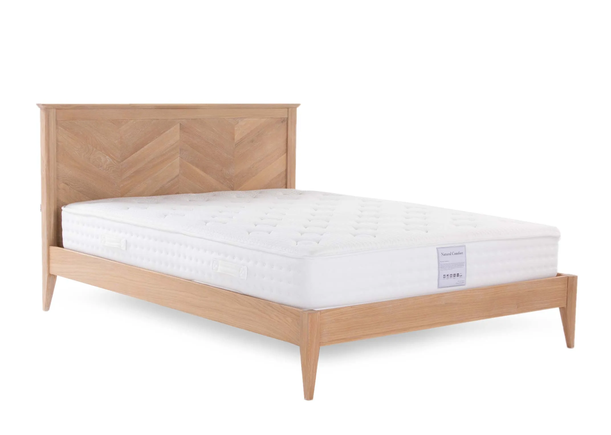 A chevron wood bedframe with a mattress from EZ Living Furnitures Chevron range. Angled view of bed with mattress