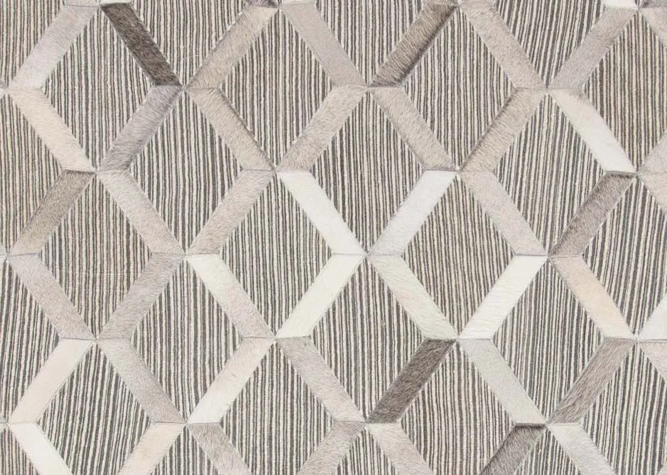 A silver & grey geometric hair on Hyde rug from EZ Living's Corbit range. Closeup show geometric design