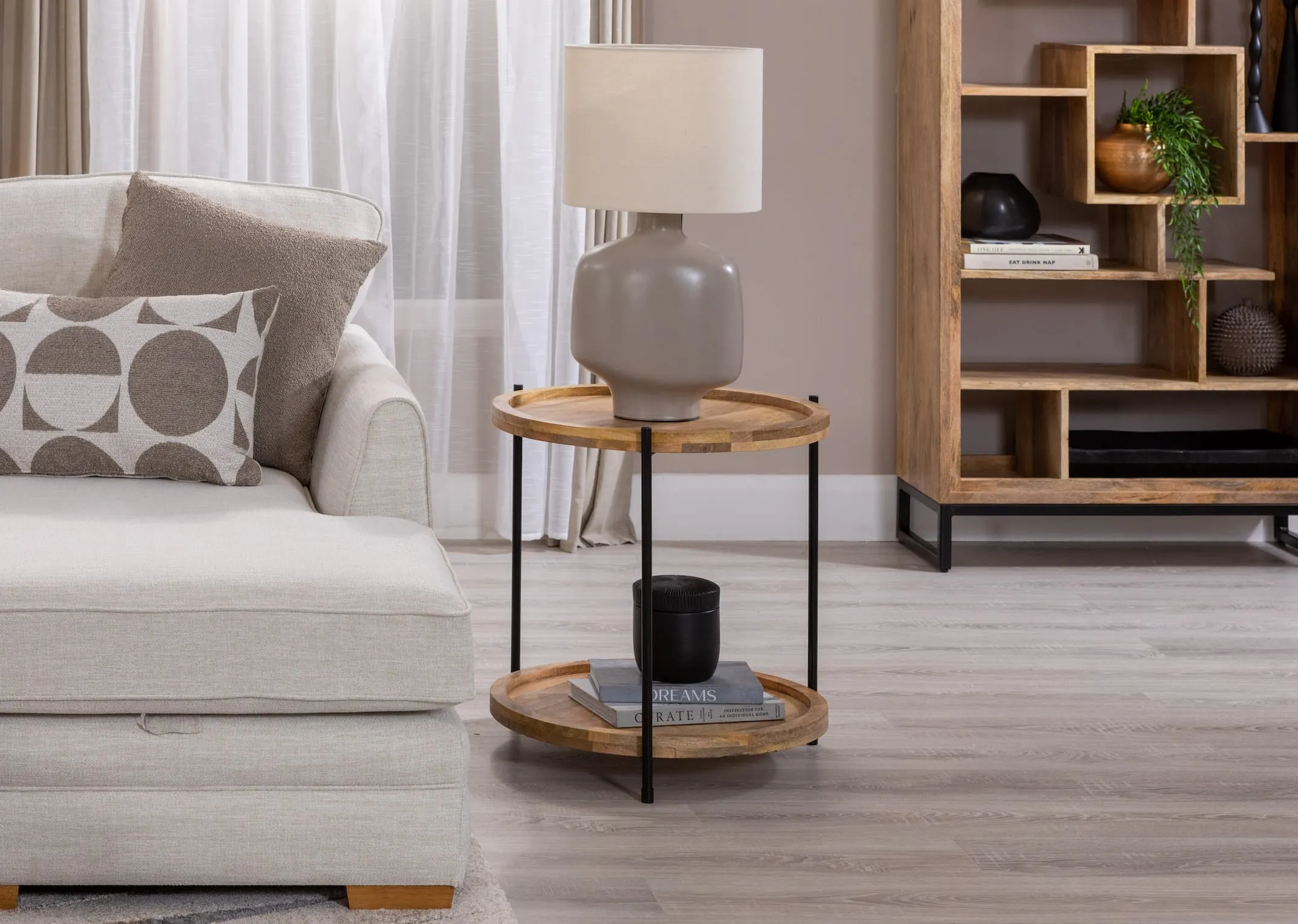 A lifetsyle imahe of the Brianna Corner sofa with Mango side table with Retro lamp