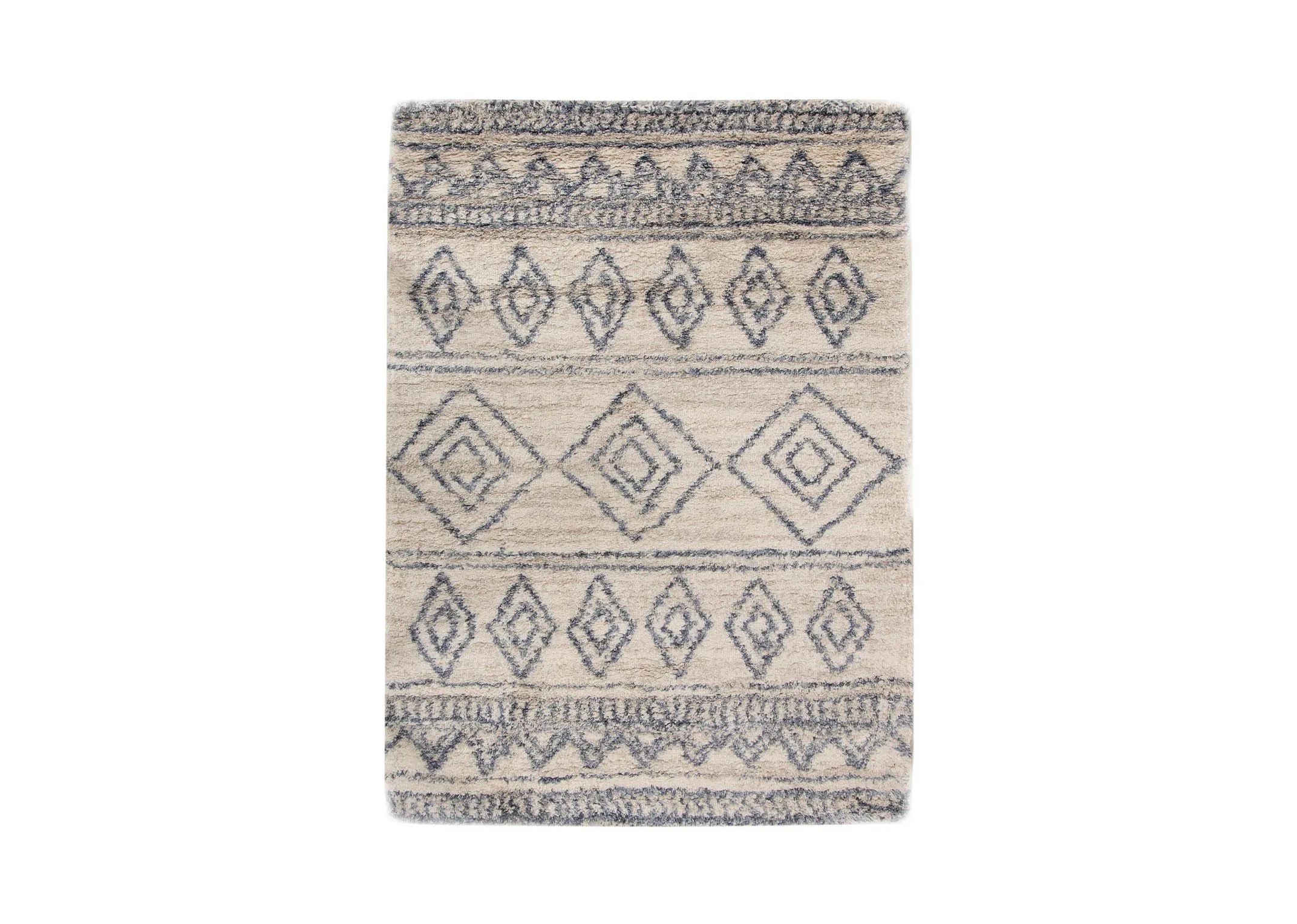 A creamy white deep pile rug with blue Aztec print from EZ Livings Sula range. Vertical view of print and subtle design