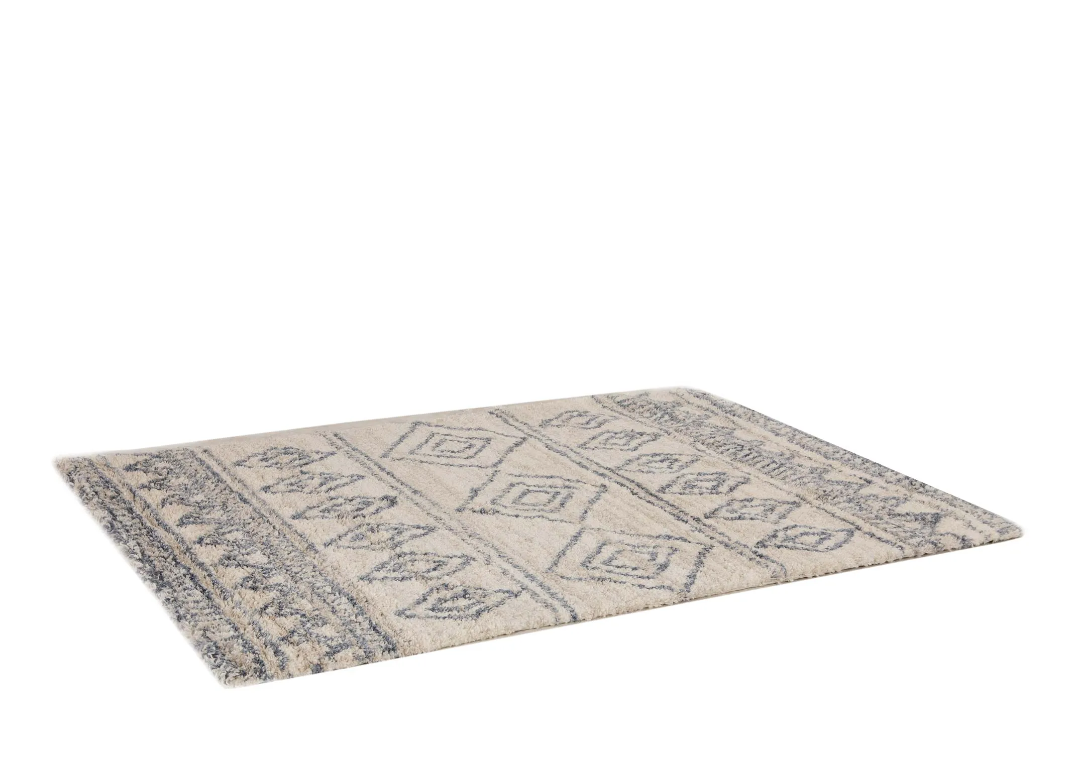 A creamy white deep pile rug with blue Aztec print from EZ Livings Sula range. Angled view