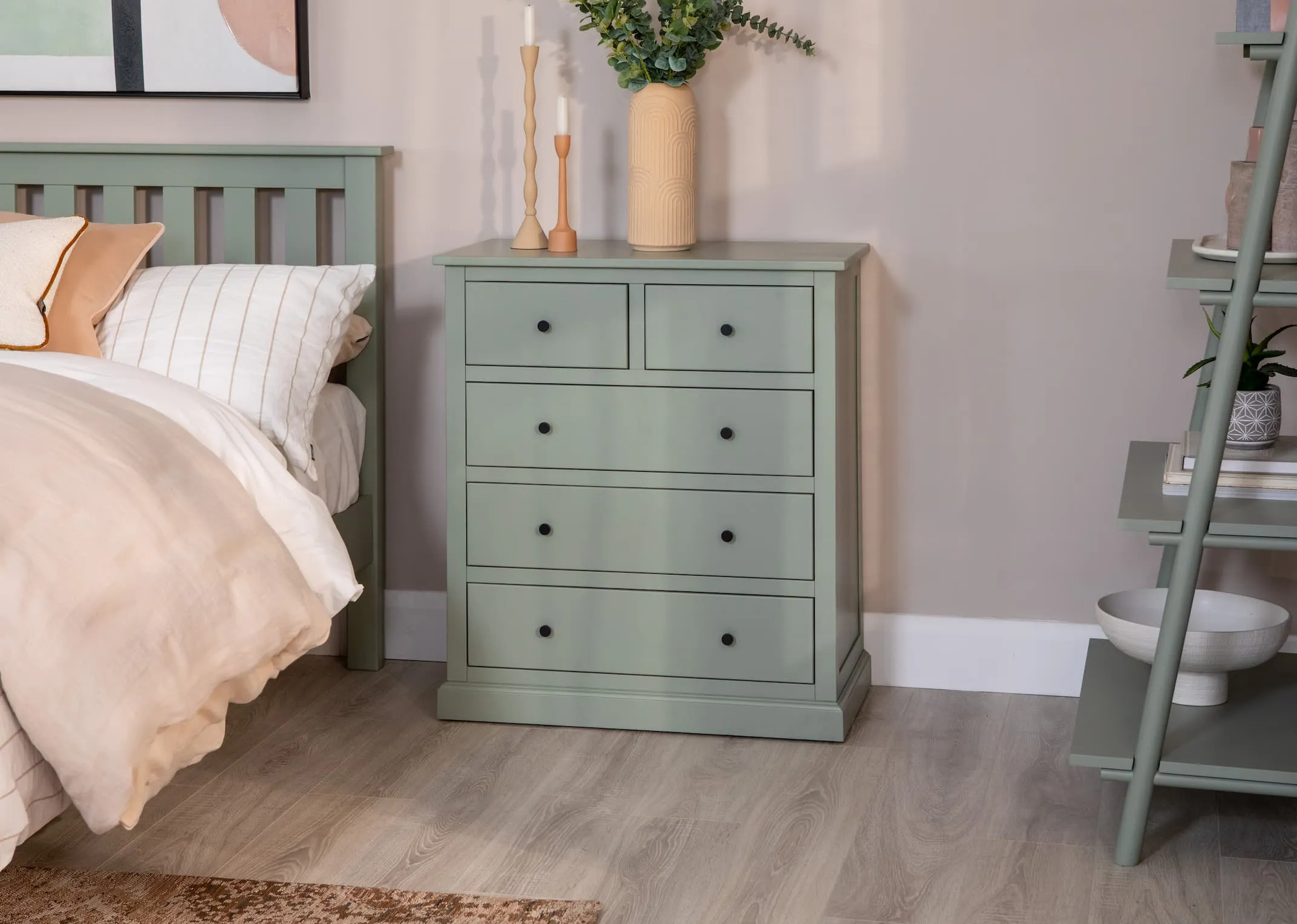 A green pine wood chest with 5 drawers from EZ Living Furnitures Atlas range. Closeup of drawer interior with it open