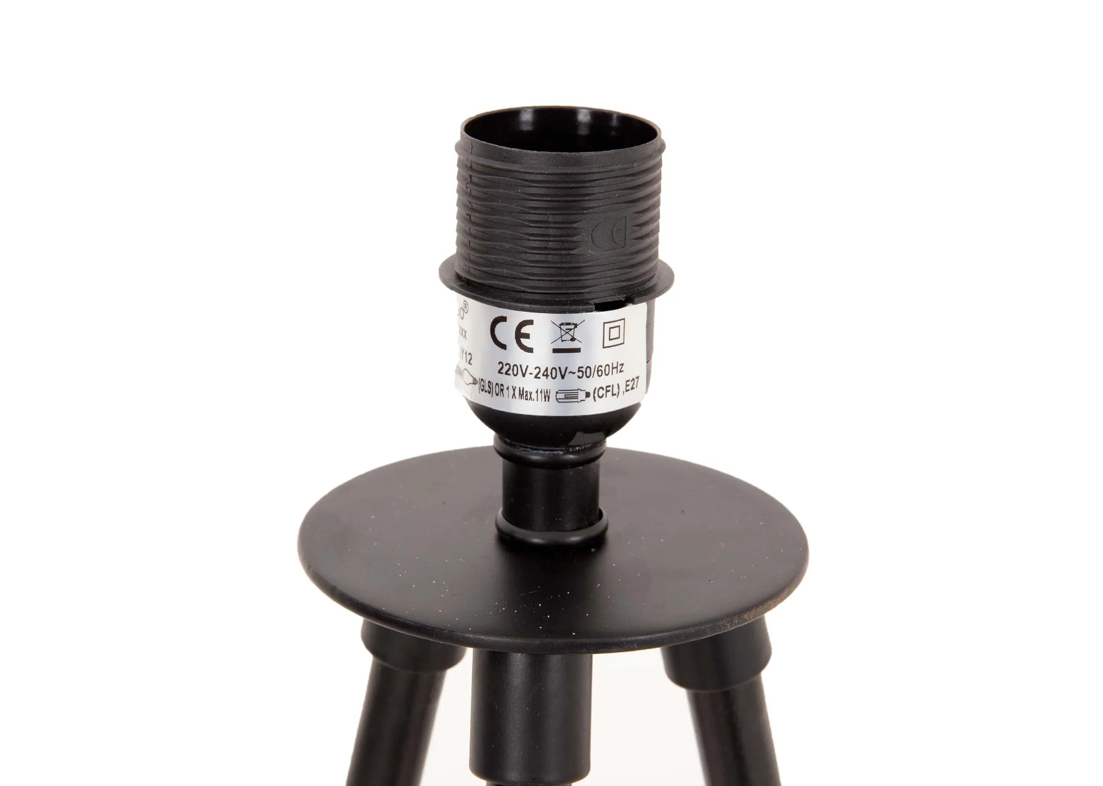 A lifestyle image of the Nola dining table with Cape chairs and Metal floor lamp.