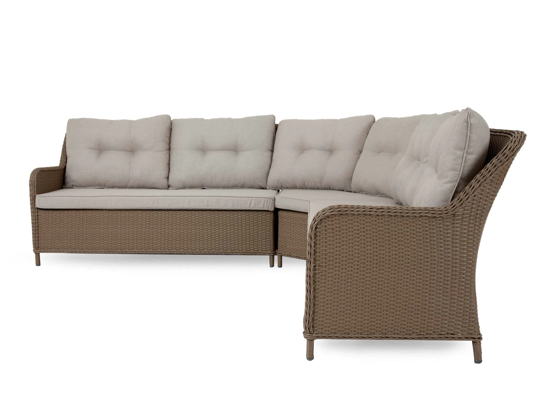 A lifestyle image of the Marbella corner garden set in a backgarden with Luxor rug and a selection of cushions.