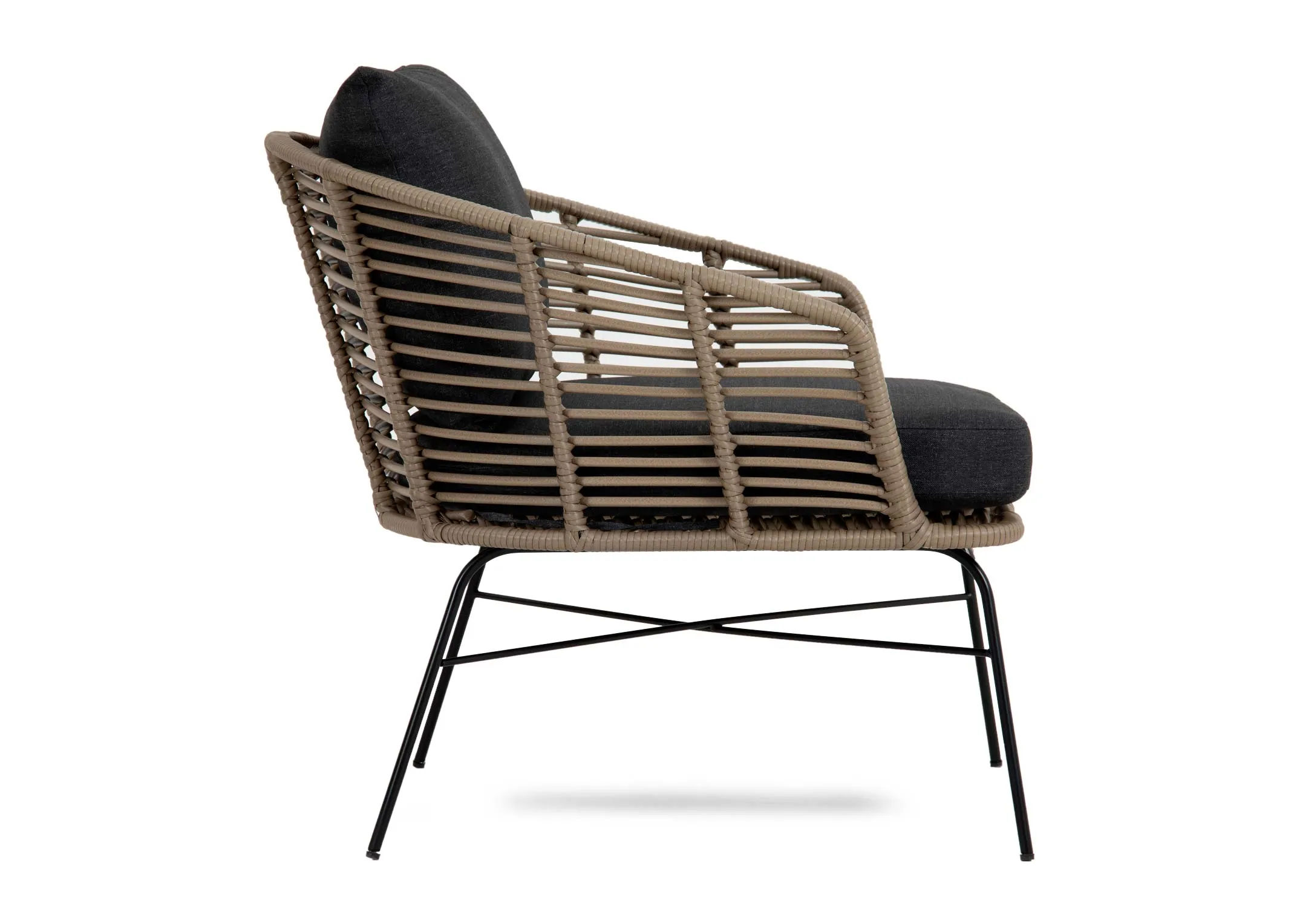 A wicker framed armchair from EZ Livings Tangier range. Side view of high arms