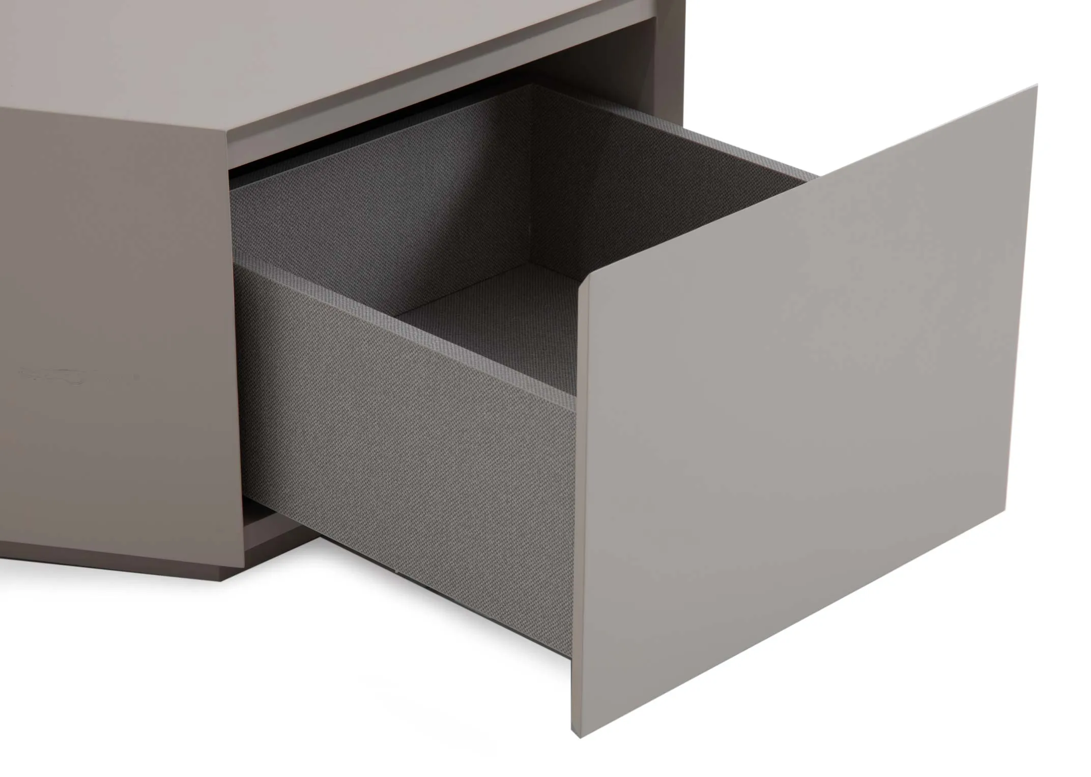 An off-white hexagonal plinth coffee table from EZ Livings Jonas range. Closeup of drawer opened.