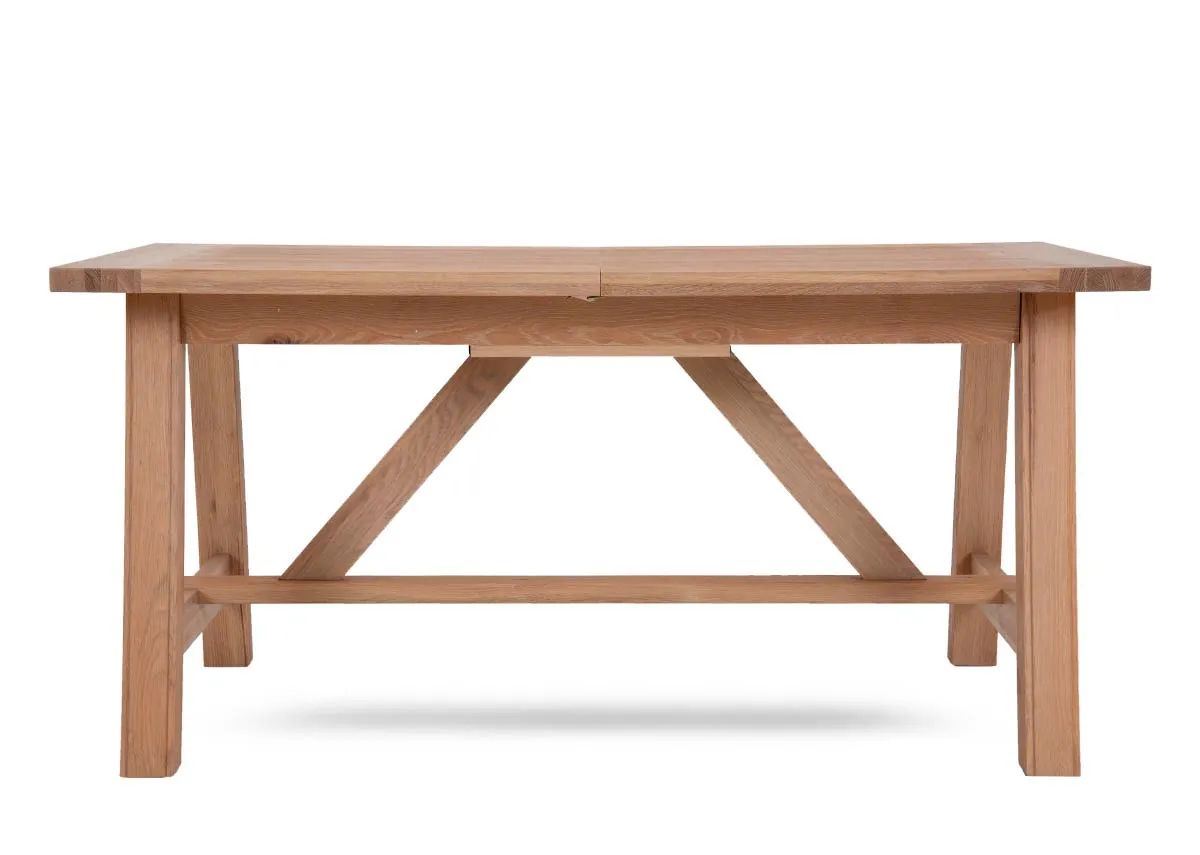 An oak dining table from EZ Livings Albany range. Front view of table unextended