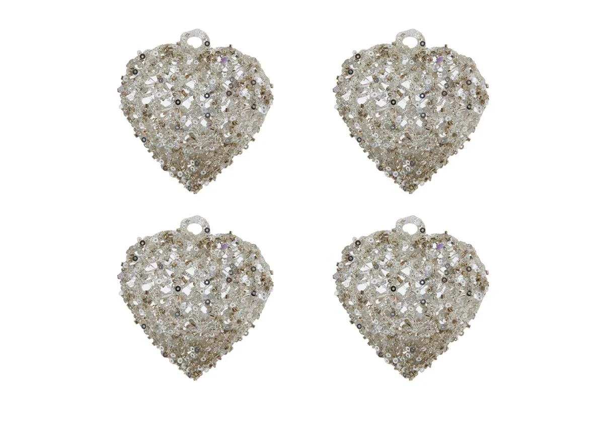 A set of 4 heart shaped silver baubles from EZ Livings Christmas range. Front view of Step into Christmas set.