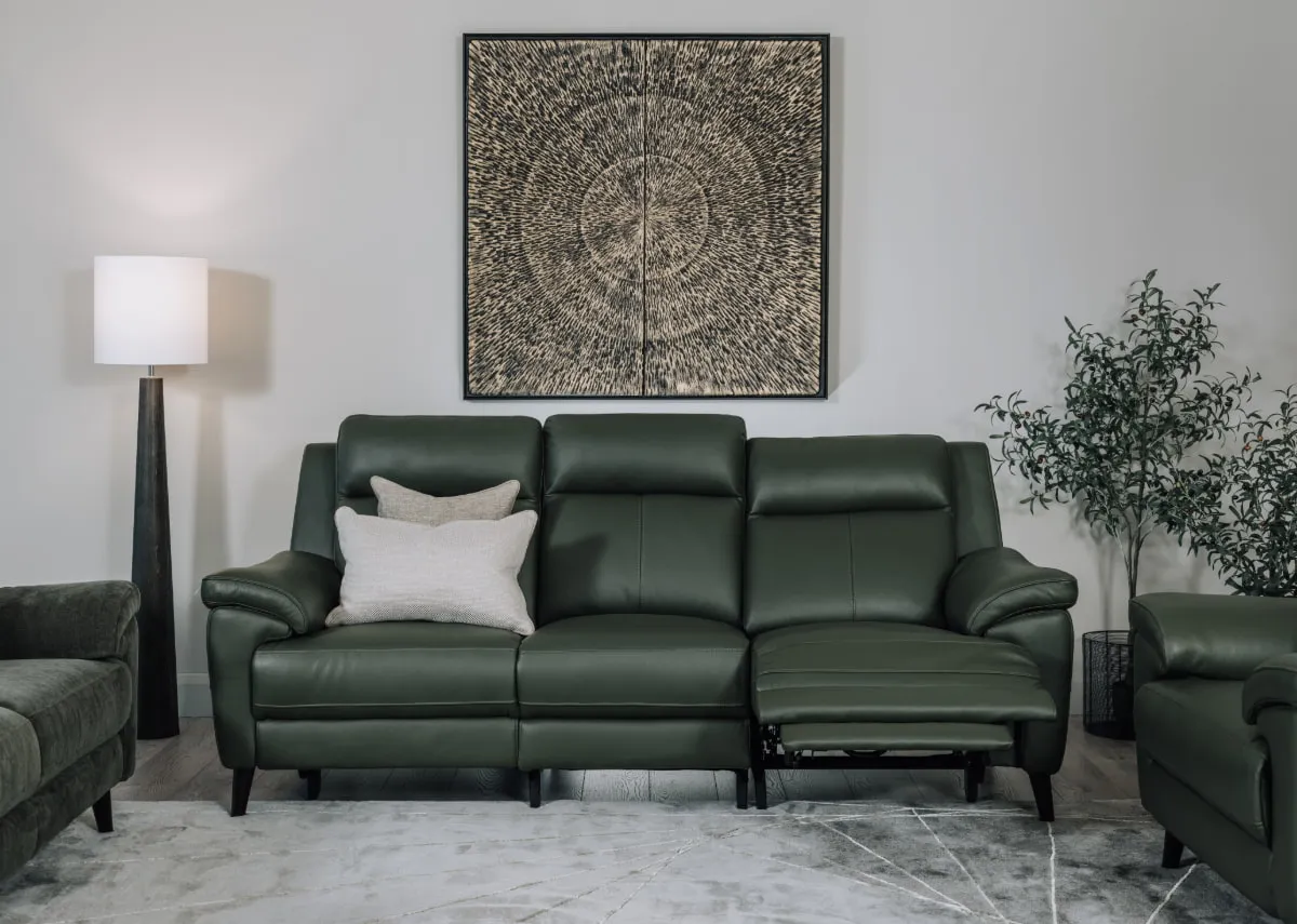A lifestyle image of the Elliot 3 seater sofa reclined with Dara canvas.