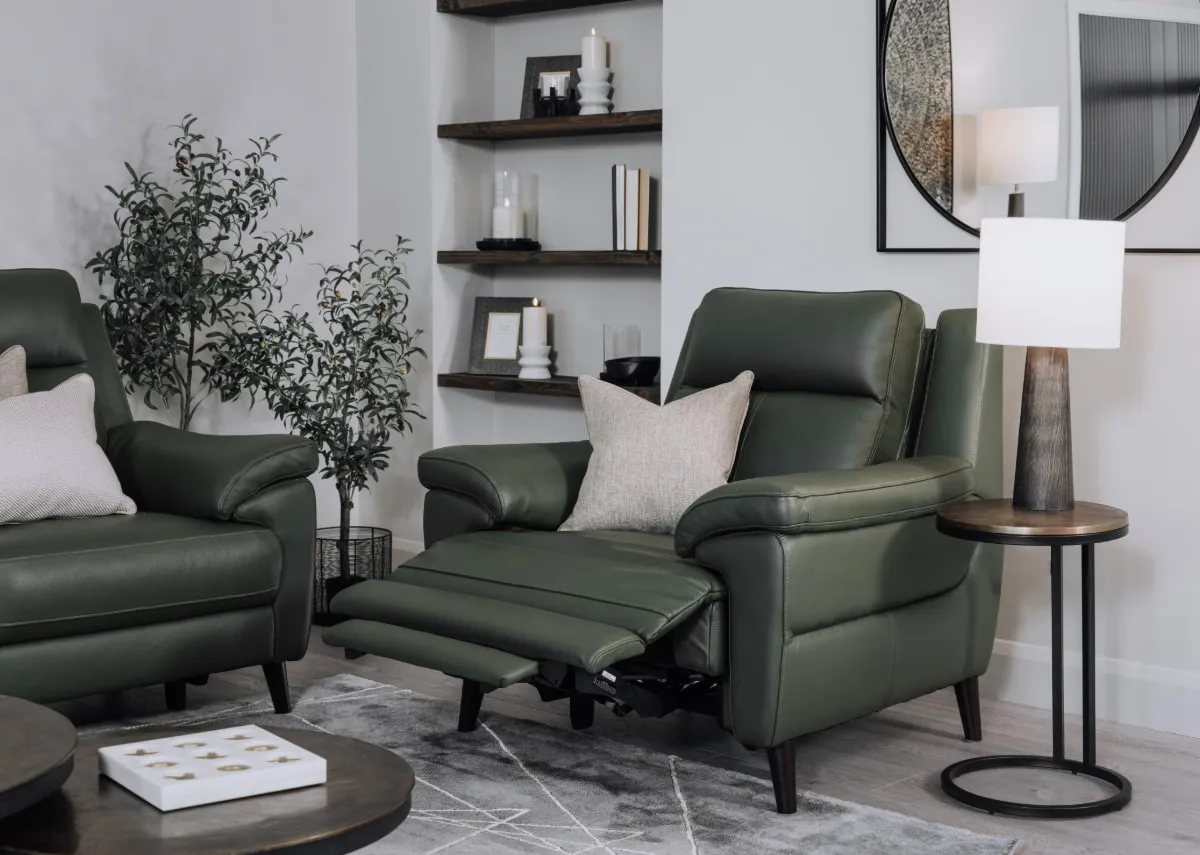 A lifetsyle image of the Elliot power recliner fully reclined with toko side  table &