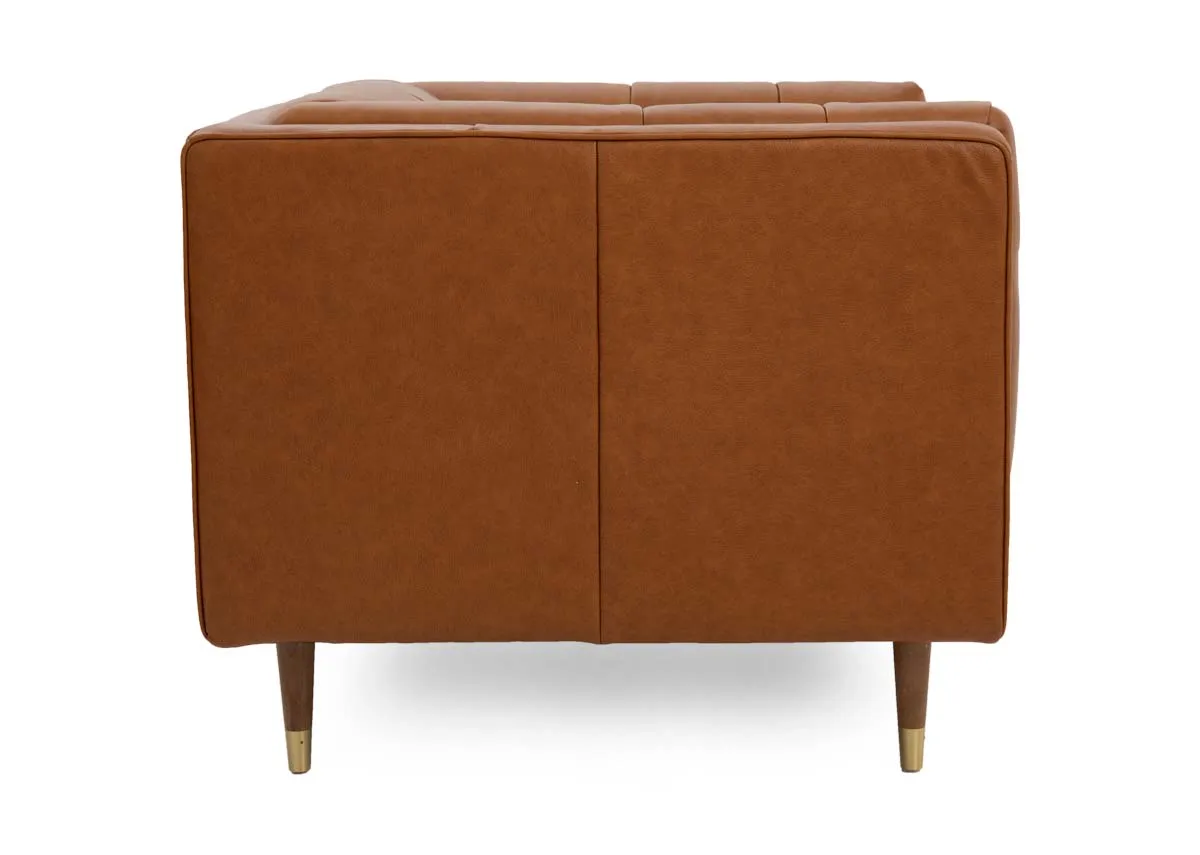 A tan leather armchair with button detail from EZ Livings Grace range.Side view