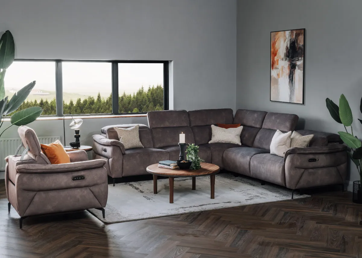 A lifestyle image of the Carlton corner sofa with breeze coffee table and carlton recliner.