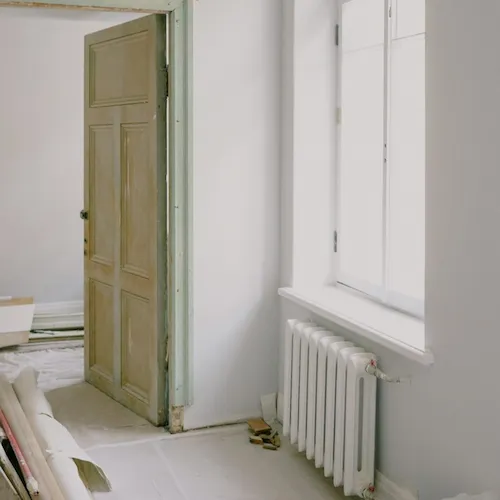 Radiator on wall in home.