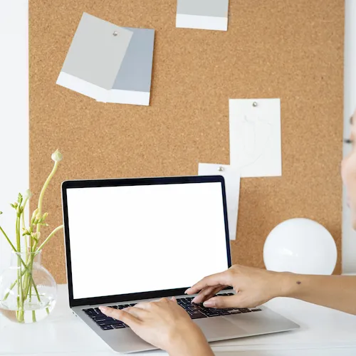 Cork board with memos attached.