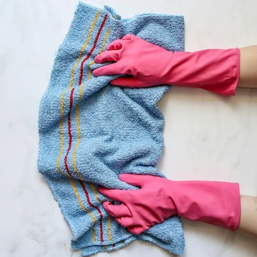 Cloth Cleaning with rubber gloves.