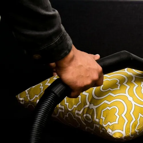 Cushion being steamed cleaned