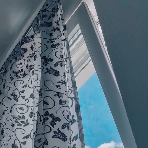 Curtains open letting sunlight in