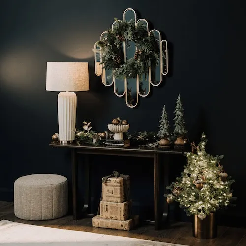 Christmas pine cone and needle wreath hanging from mirror