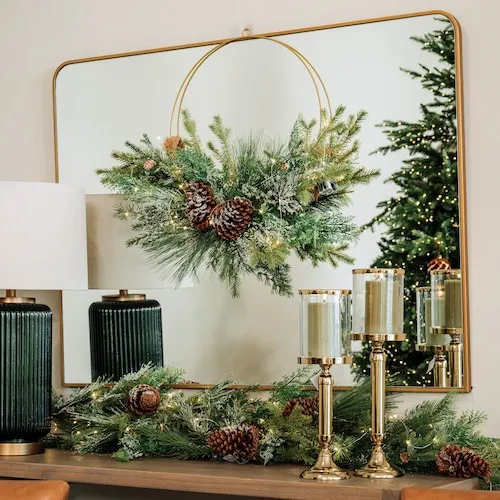 Wreath hanging off wall mirror at EZ Living Furniture.
