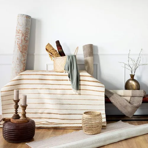 A selection of rugs, baskets, and vases from EZ Living Furniture.