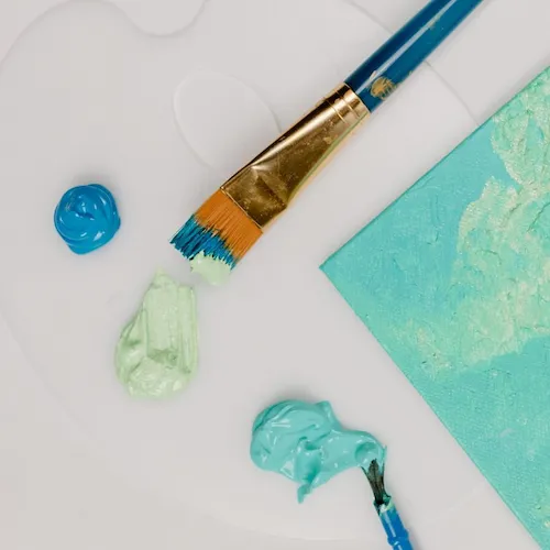 Paint brush painting canvas.