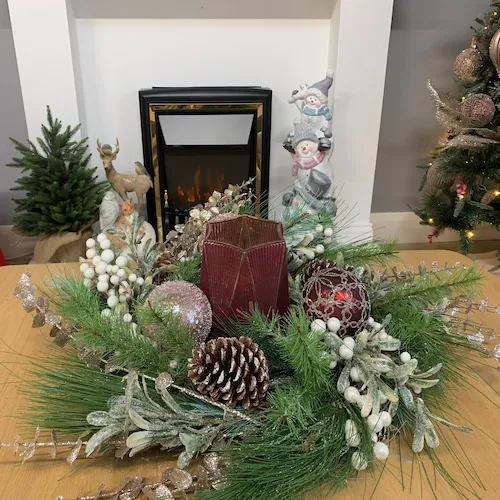Christmas wreath decorated with baubles and picks from EZ Living Furniture.