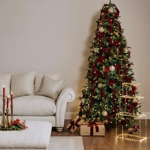 Red and gold Christmas tree theme at EZ Living Furniture.