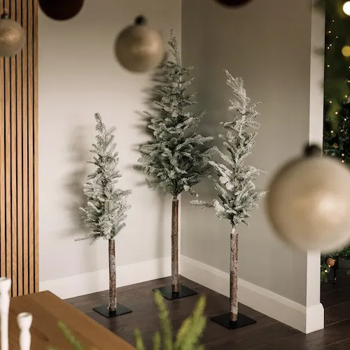 Small decorative snow-tipped trees from EZ Living Furniture.