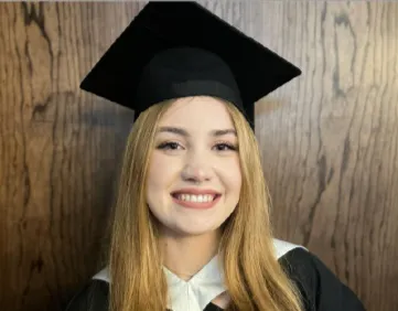 Gabby in her graduation cap and gown